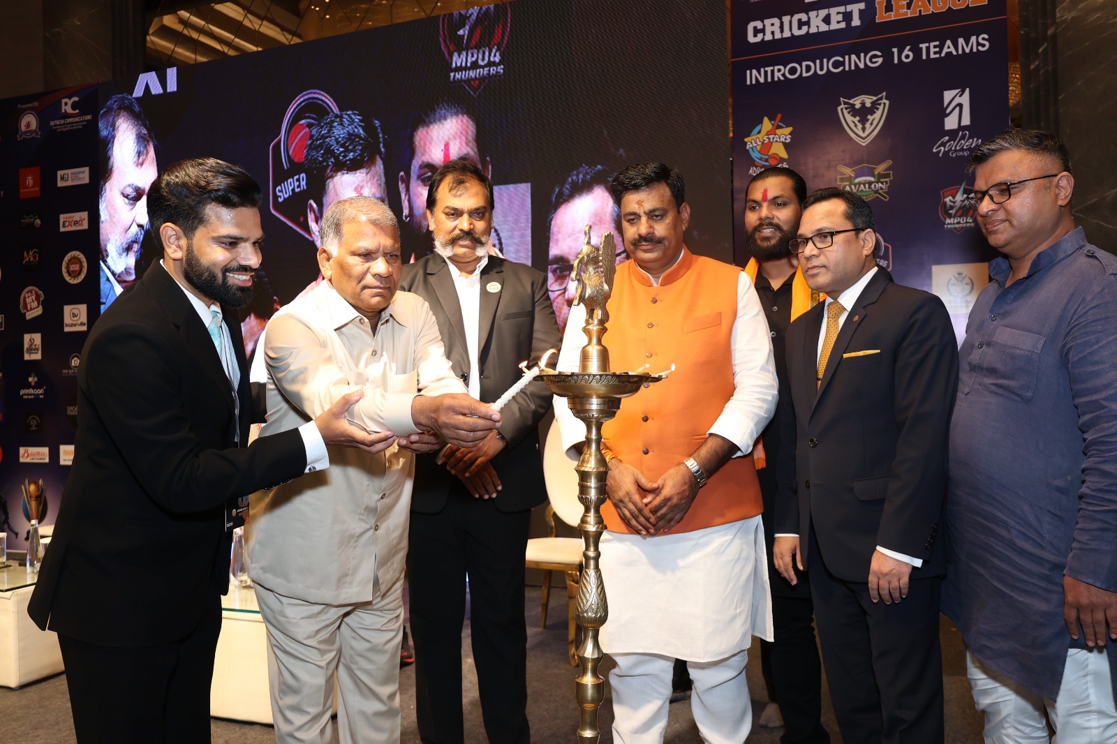 BPL event — traditional lamp lighting ceremony with team representatives